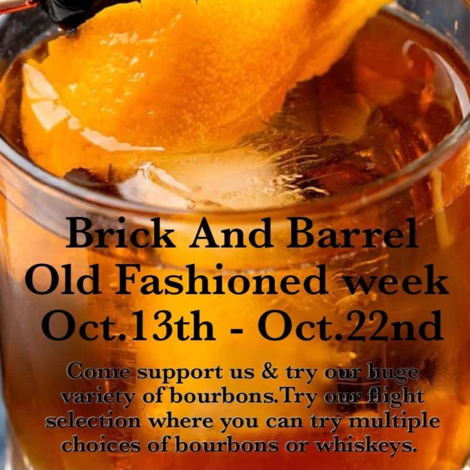 Close-up of an Old Fashioned cocktail with an orange peel and ice, advertising Brick and Barrel's Old Fashioned week.
